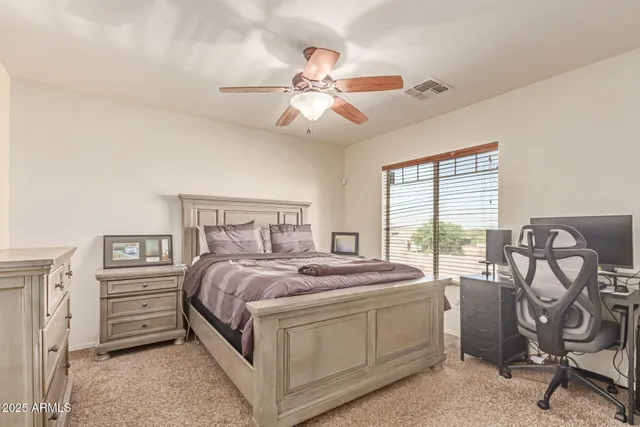 a bed room with a bed and a chandelier