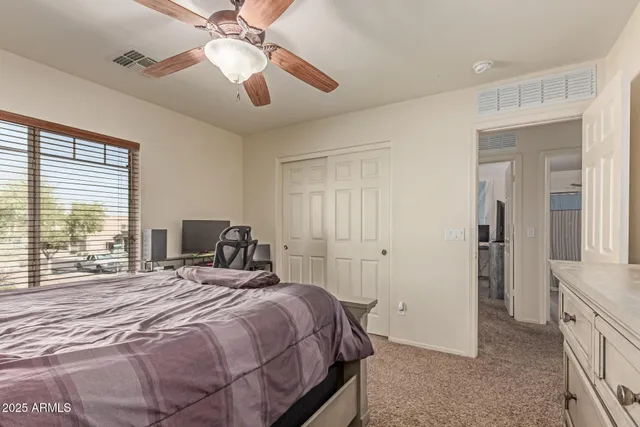 a bedroom with a bed and window