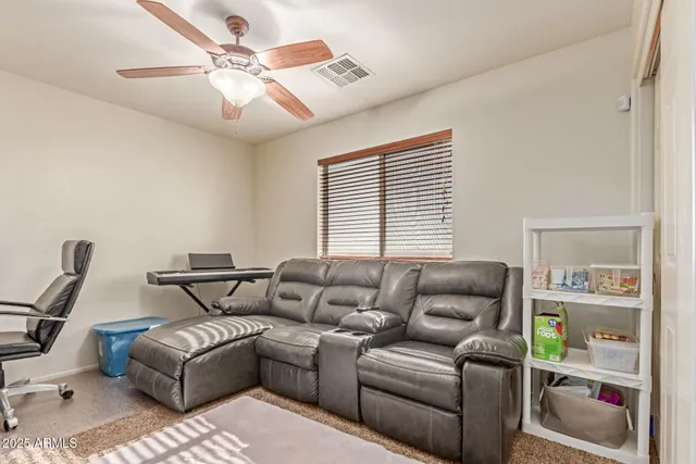 a living room with furniture and a window