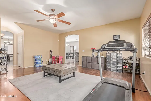 a living room with furniture and white walls