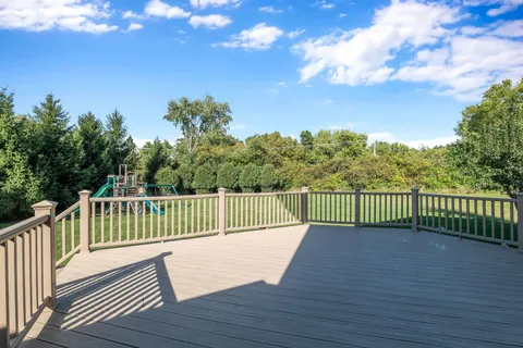 a view of a balcony with wooden fence