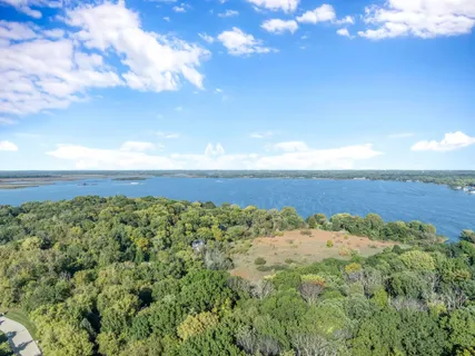 a view of a field with an ocean