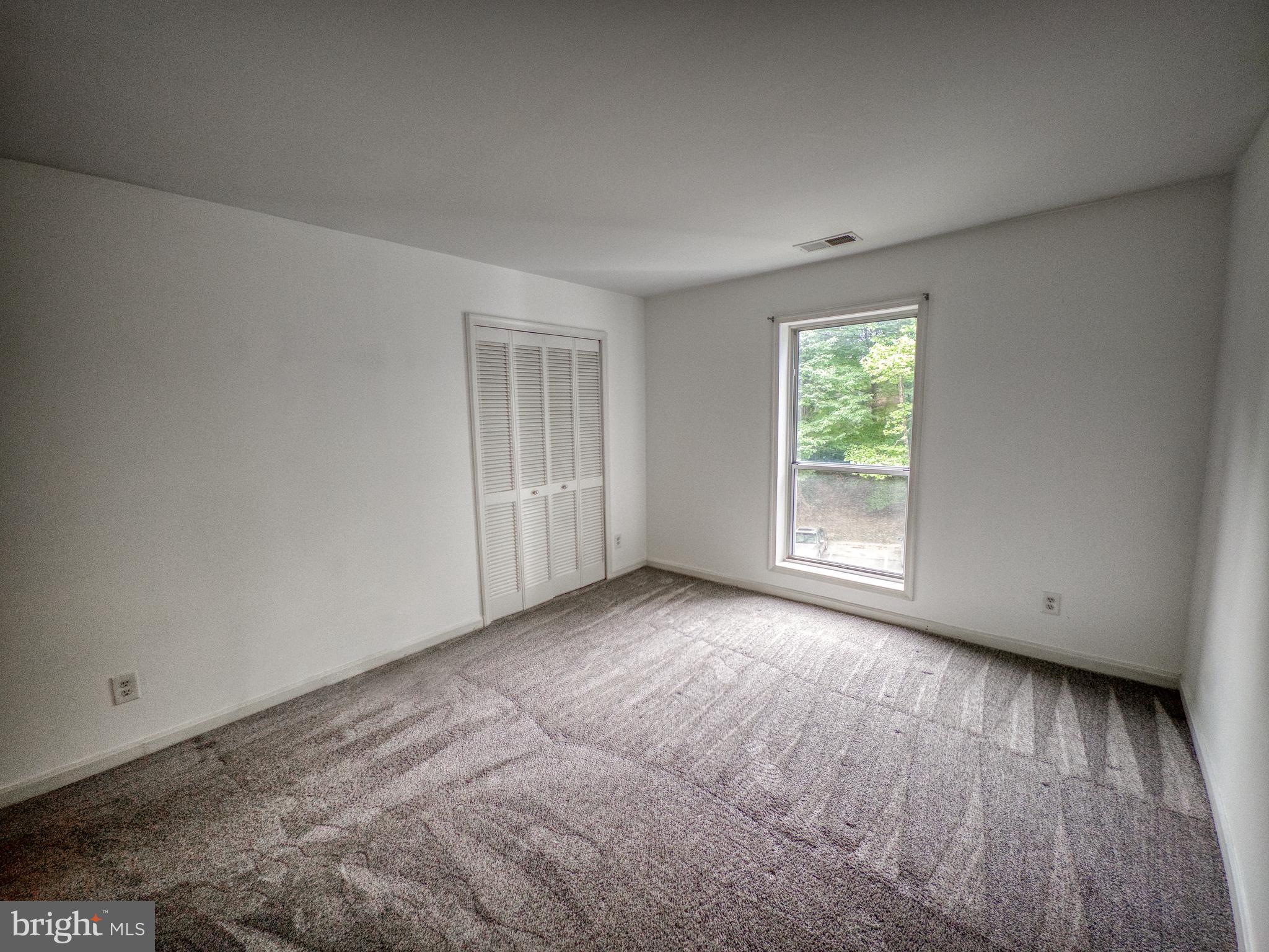3178 Summit Square Drive, Unit 3C9 Oakton, VA 22124 - Photo 17 of 21 an empty room with windows