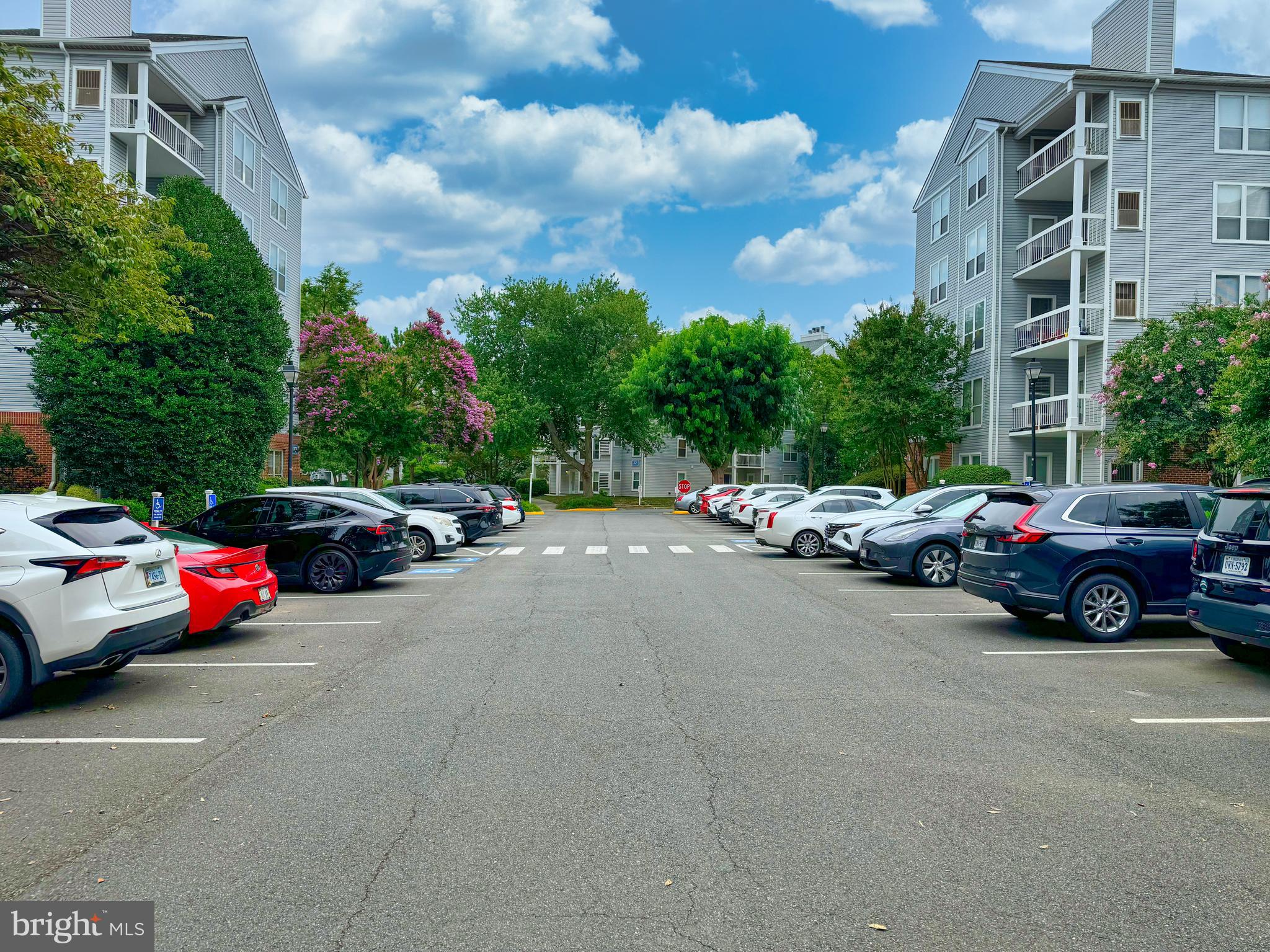 3178 Summit Square Drive, Unit 3C9 Oakton, VA 22124 - Photo 4 of 21 a view of cars parked in front of a building