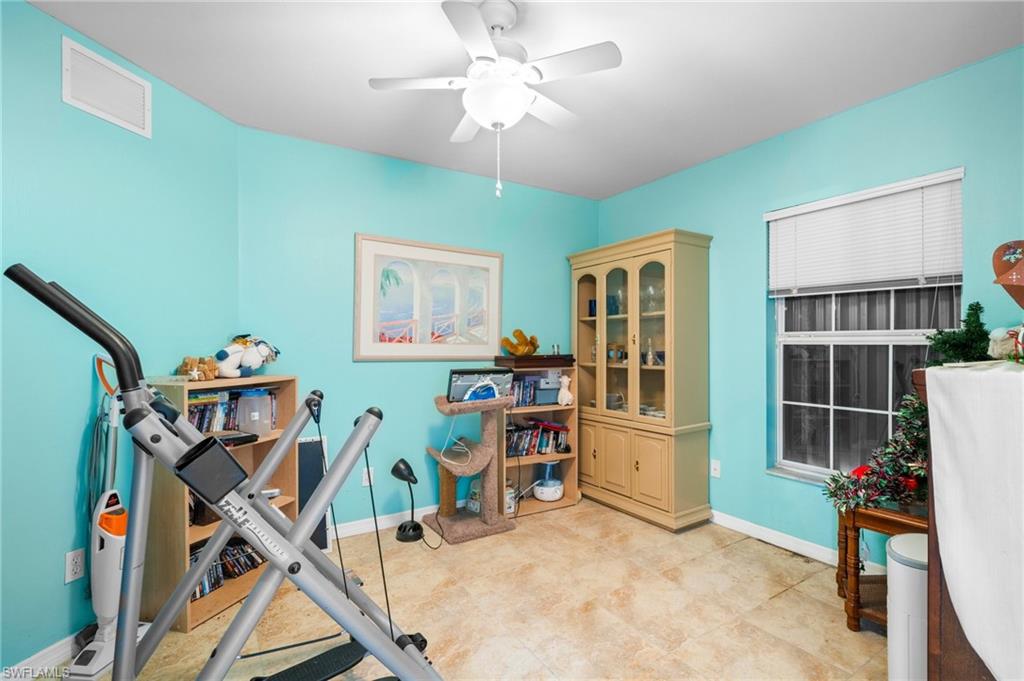 15601 Cemetery Road Fort Myers, FL 33905 - Photo 11 of 20 Workout room featuring a ceiling fan and baseboards