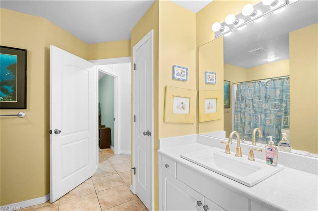 15601 Cemetery Road Fort Myers, FL 33905 - Photo 12 of 20 Full bathroom featuring vanity, baseboards, and tile patterned flooring