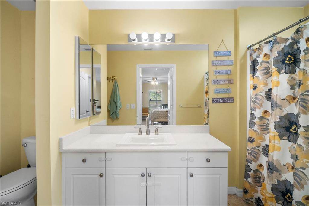 15601 Cemetery Road Fort Myers, FL 33905 - Photo 8 of 20 Ensuite bathroom with vanity, toilet, and a shower with curtain
