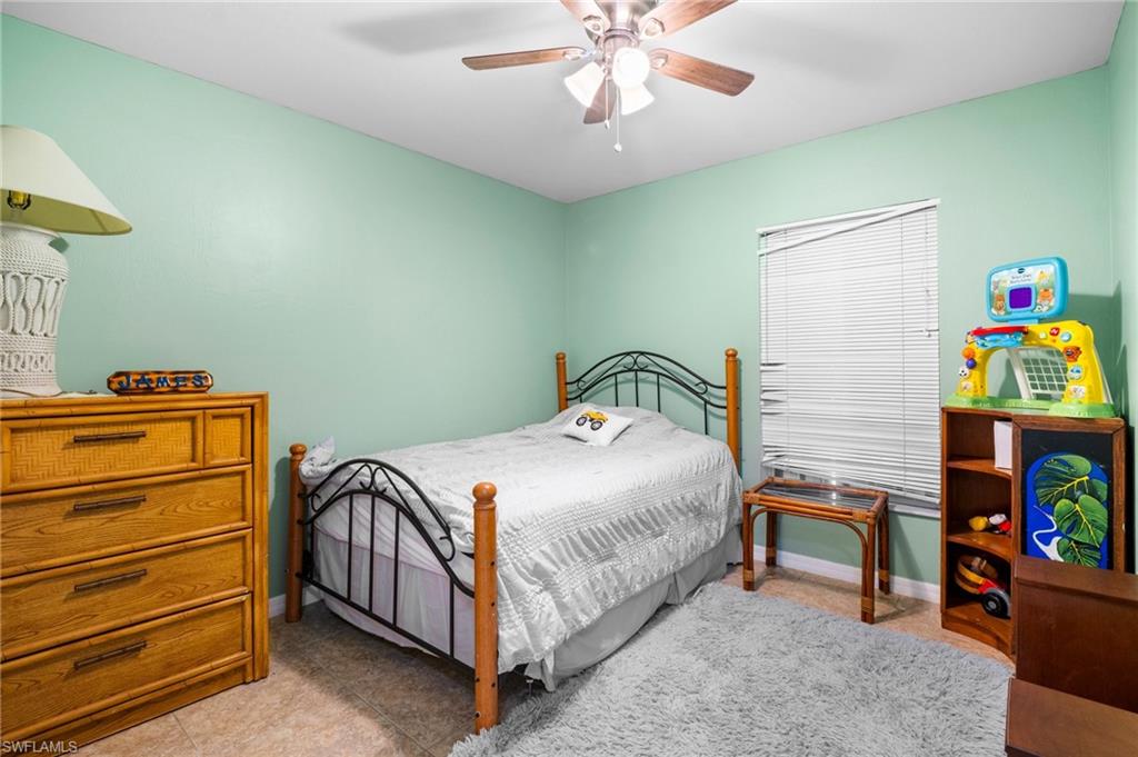 15601 Cemetery Road Fort Myers, FL 33905 - Photo 10 of 20 Bedroom with a ceiling fan and baseboards