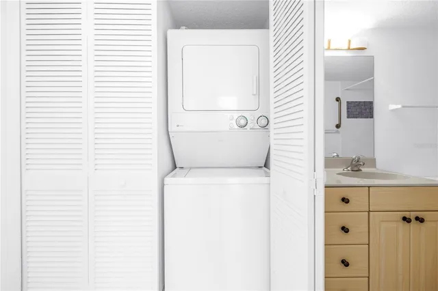 a view of a swimming pool and outdoor seating