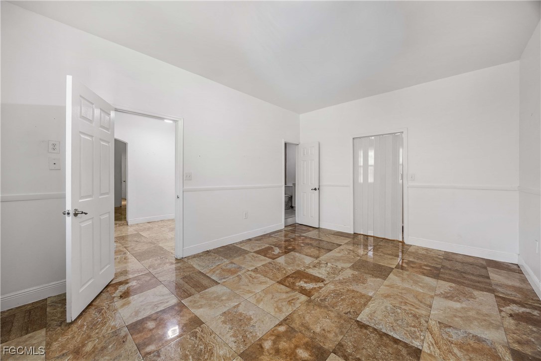 360 18th Street Northeast Naples, FL 34120 - Photo 23 of 37 a view of an empty room