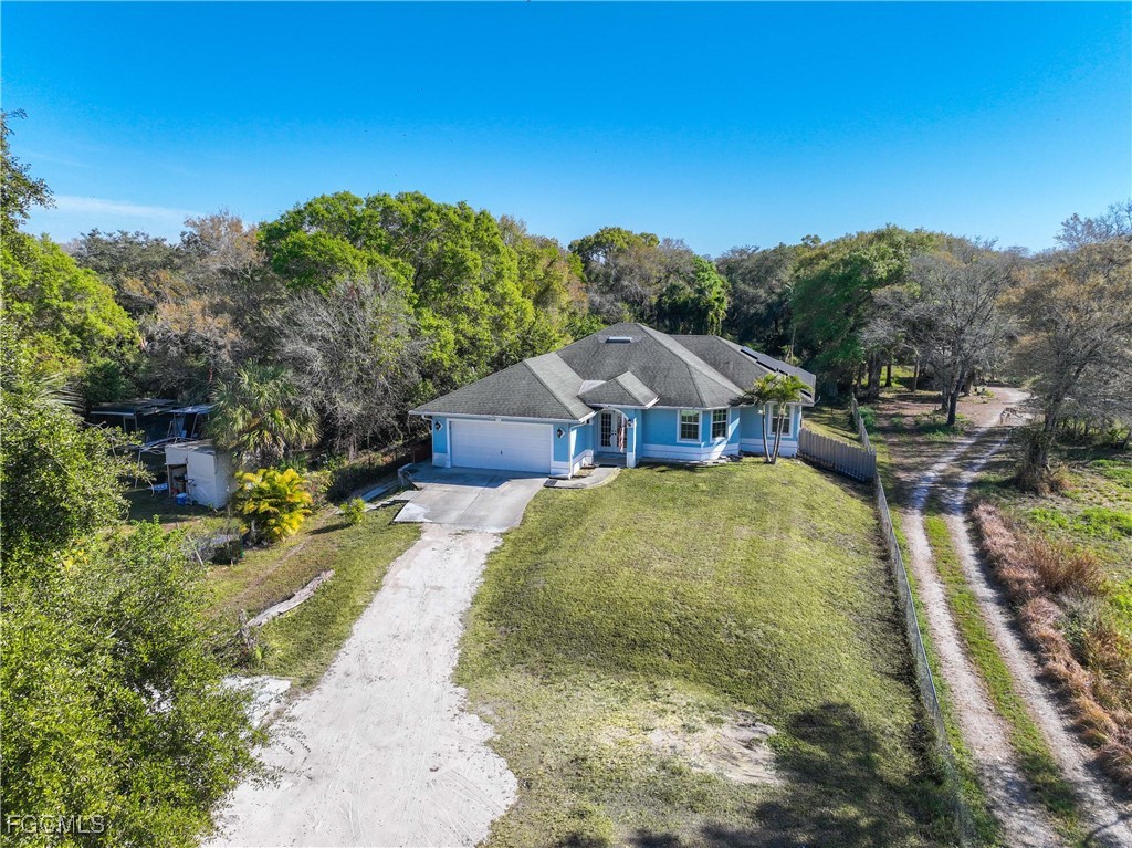 360 18th Street Northeast Naples, FL 34120 - Photo 3 of 37 a view of yard with swimming pool