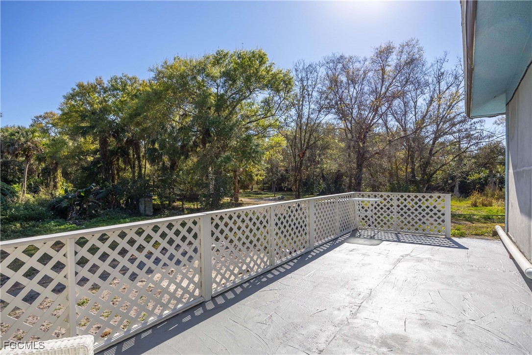 360 18th Street Northeast Naples, FL 34120 - Photo 34 of 37 a view of a roof deck with wooden fence