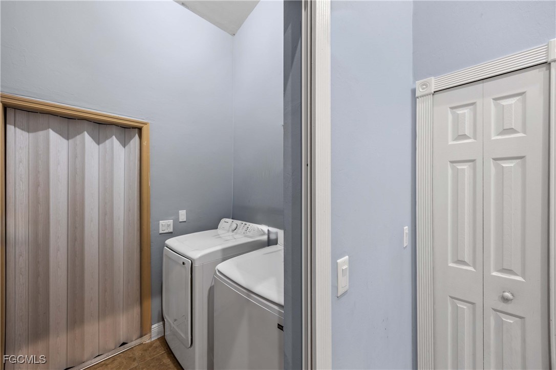 360 18th Street Northeast Naples, FL 34120 - Photo 36 of 37 a utility room with dryer and washer