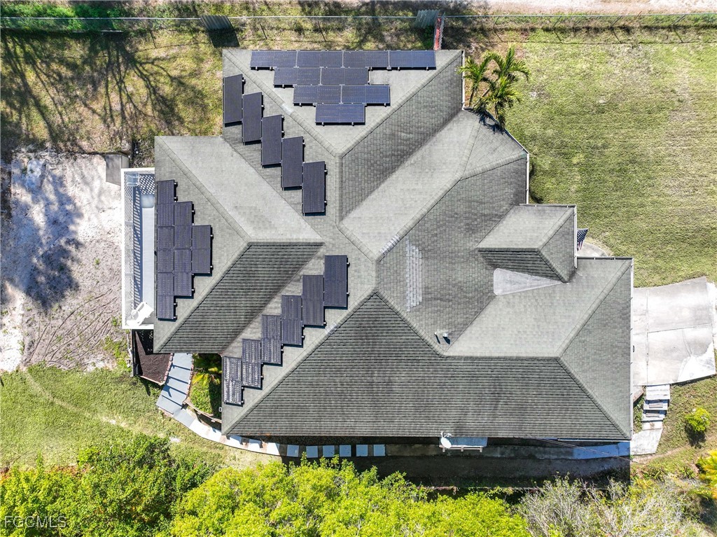 360 18th Street Northeast Naples, FL 34120 - Photo 37 of 37 an aerial view of a house with a yard and lake view