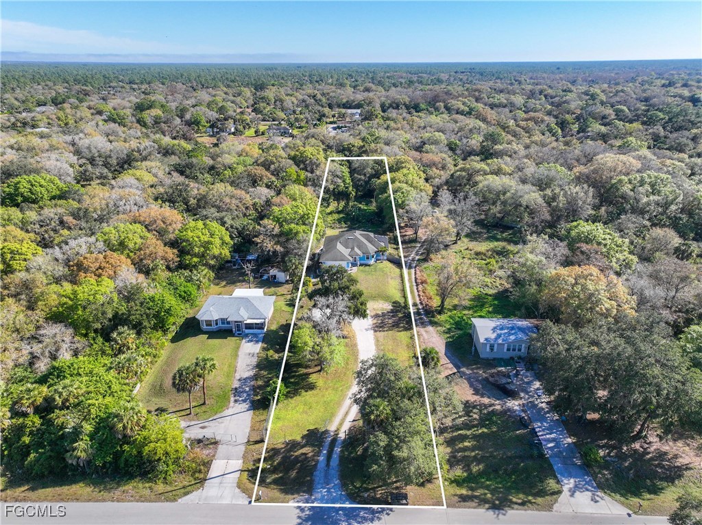360 18th Street Northeast Naples, FL 34120 - Photo 4 of 37 an aerial view of residential building and green space