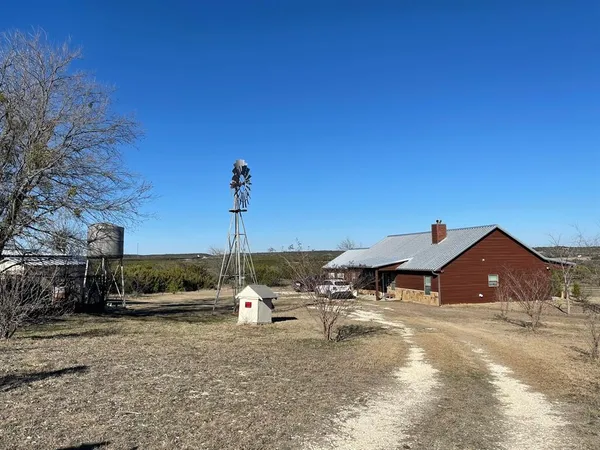 a view of a house with patio and sitting area