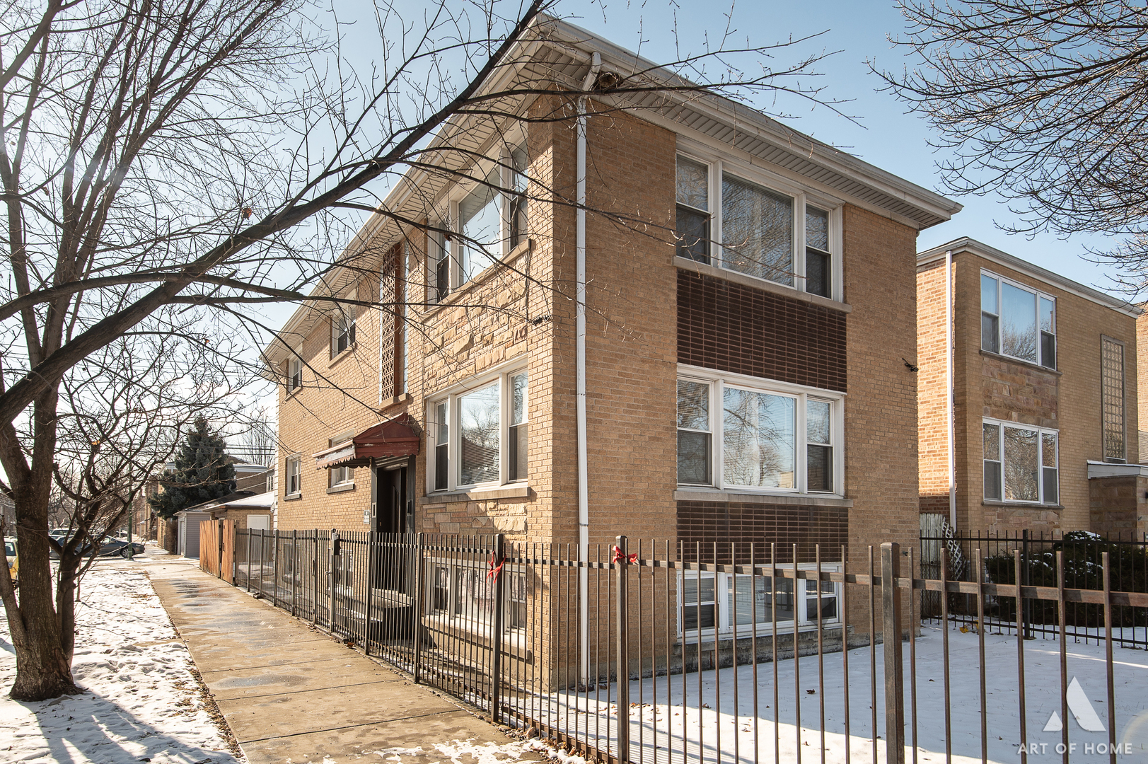 2750 North Linder Avenue, Unit 1 Chicago, IL 60639 - Photo 2 of 13 a view of a brick house with a yard