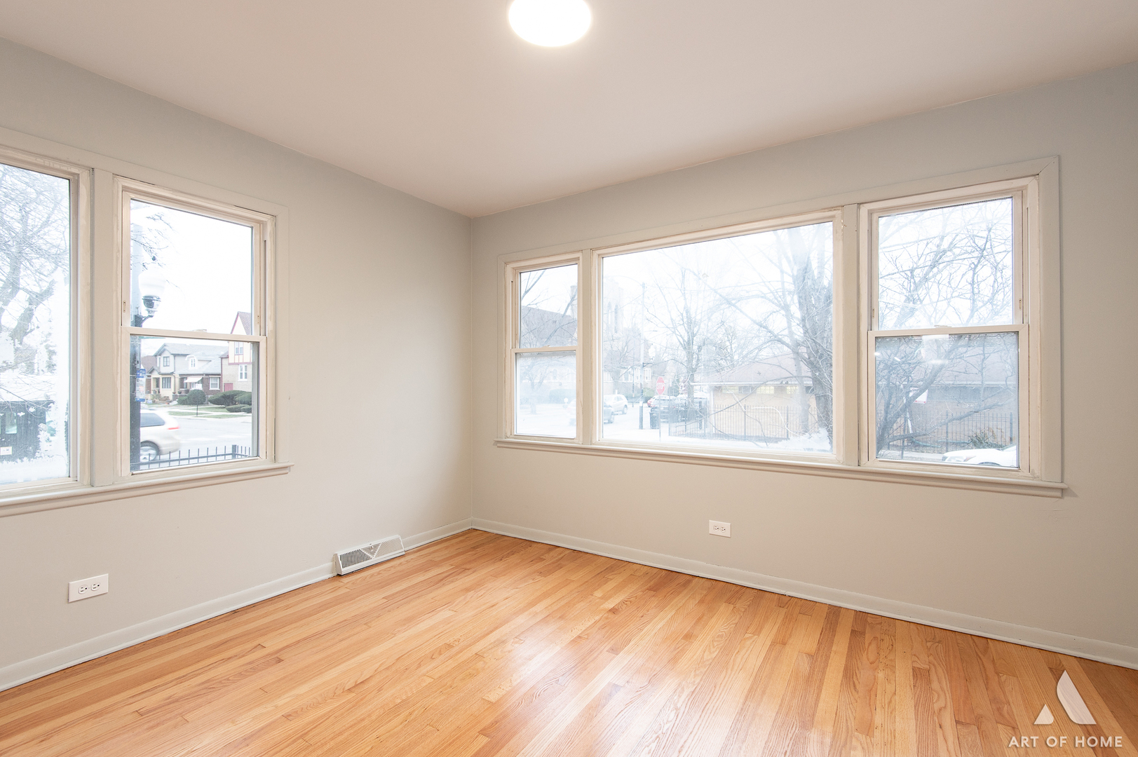 2750 North Linder Avenue, Unit 1 Chicago, IL 60639 - Photo 5 of 13 a view of an empty room with wooden floor and a window