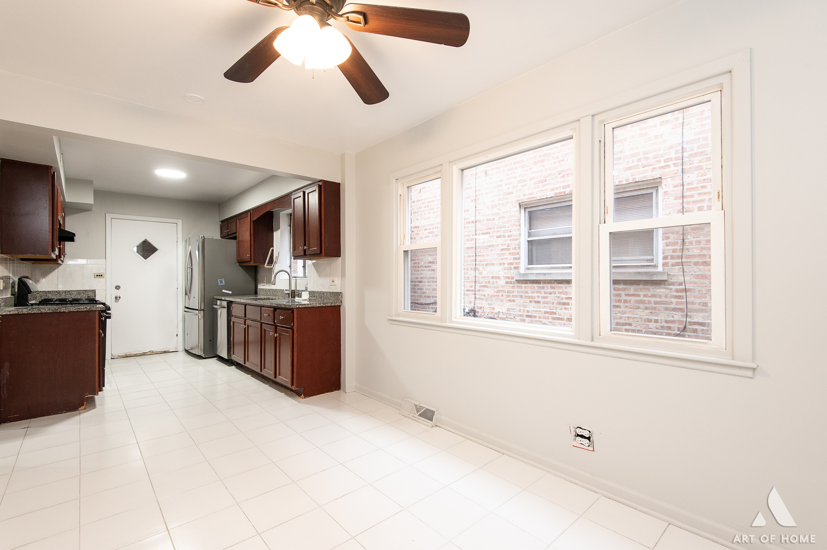 2750 North Linder Avenue, Unit 1 Chicago, IL 60639 - Photo 9 of 13 a view of kitchen with windows and ceiling fan