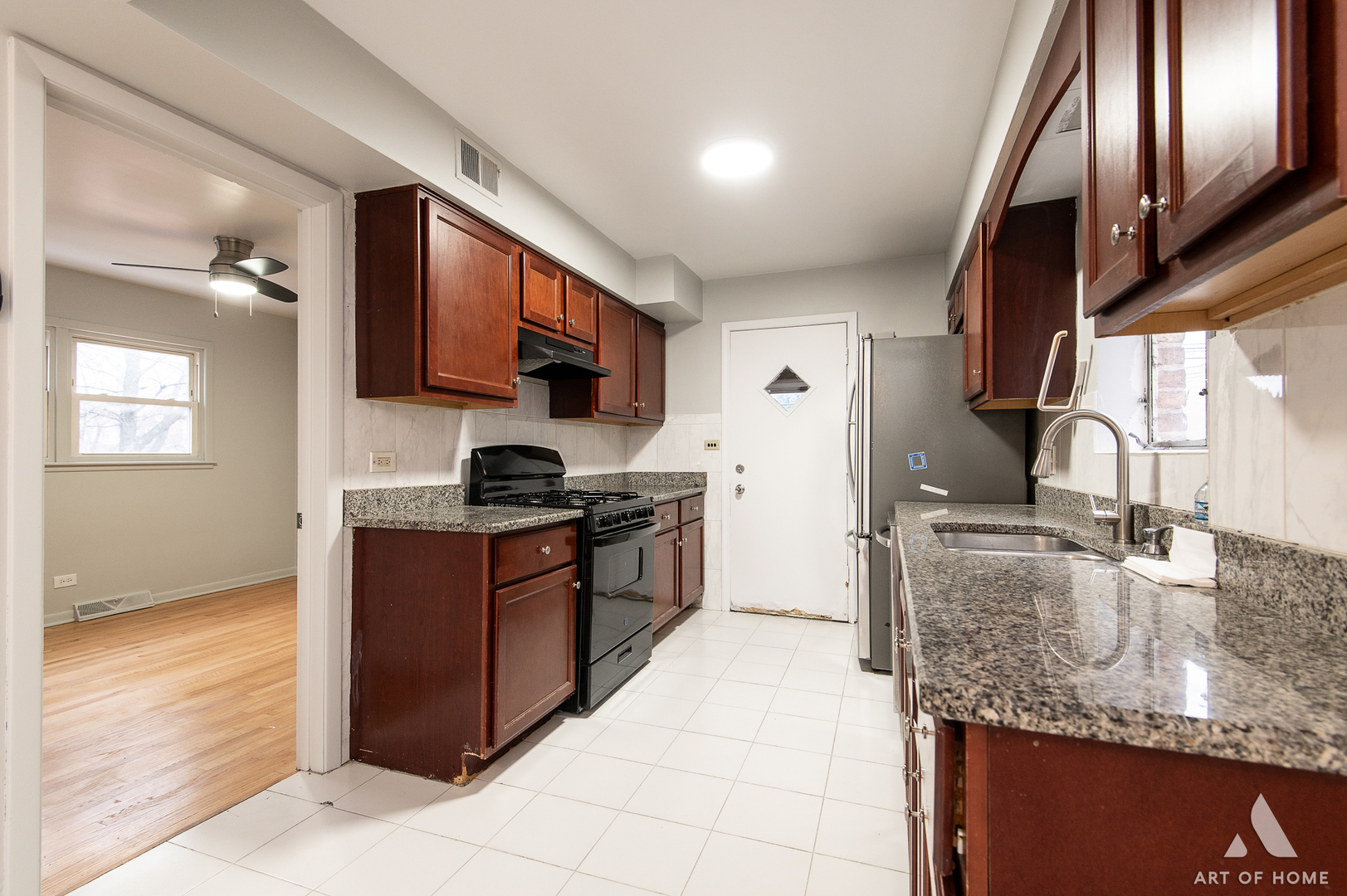 2750 North Linder Avenue, Unit 1 Chicago, IL 60639 - Photo 10 of 13 a kitchen with stainless steel appliances granite countertop a sink stove and refrigerator