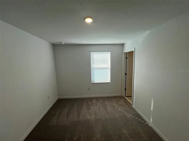 an empty room with a empty space and window