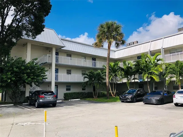a kitchen with a sink cabinets and appliances