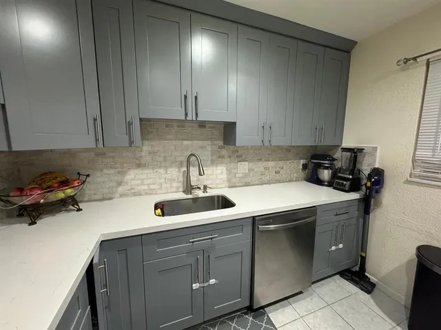 an aerial view of multiple houses with outdoor space