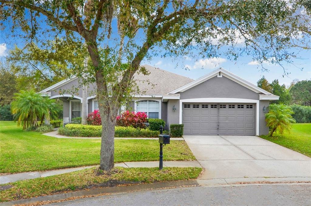 10501 Rochester Way Tampa, FL 33626 - Photo 1 of 1 a front view of house with yard and garage
