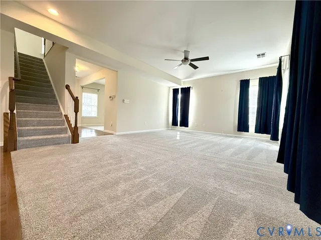 a view of a hallway with a chandelier