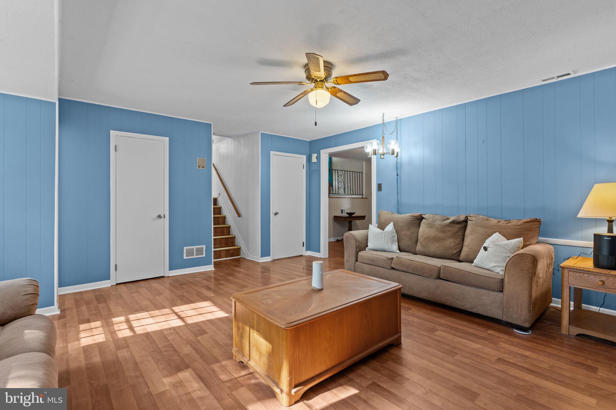 17 Highland Drive Yardley, PA 19067 - Photo 12 of 29 a living room with furniture and a chandelier