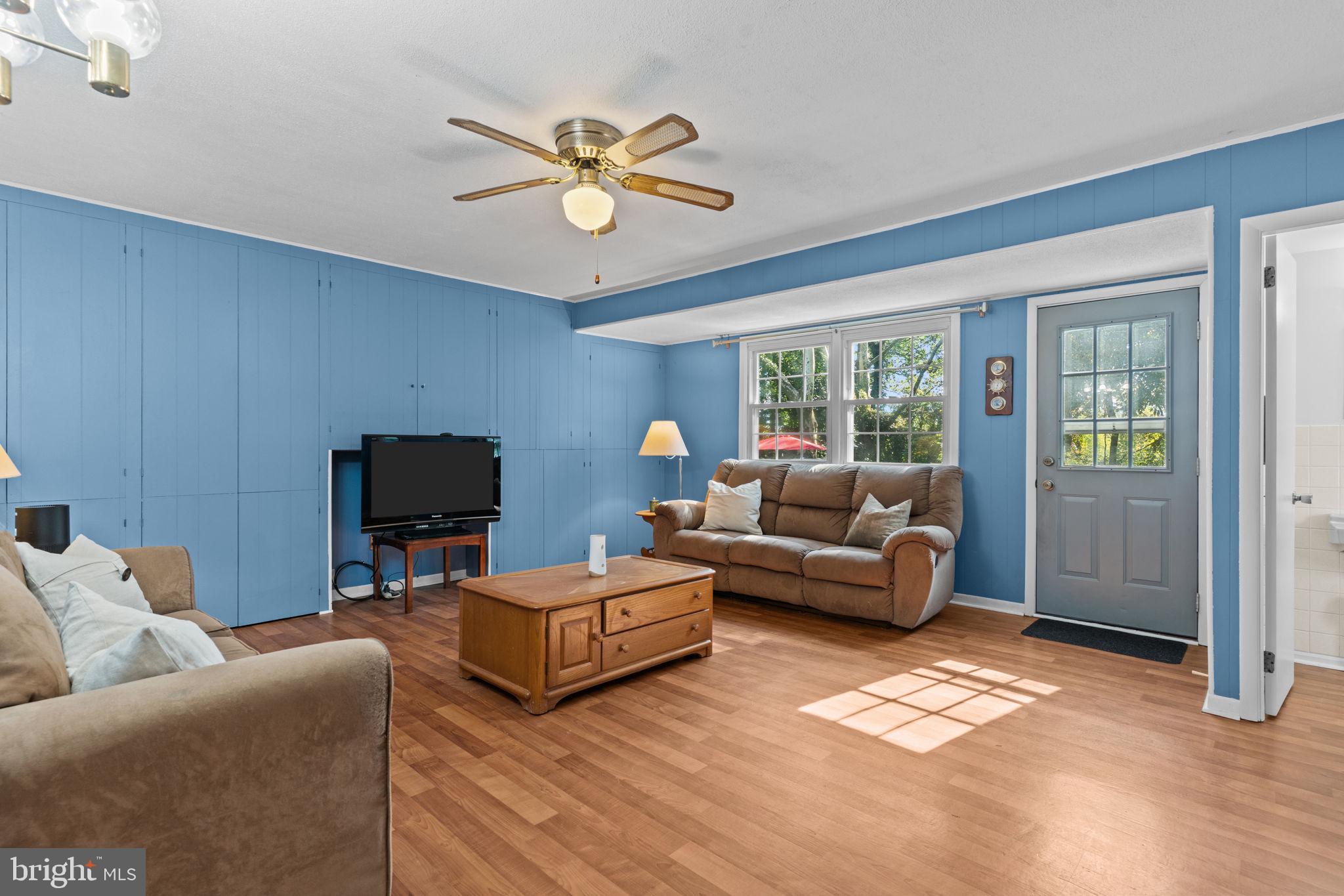 17 Highland Drive Yardley, PA 19067 - Photo 13 of 29 a living room with furniture and a flat screen tv