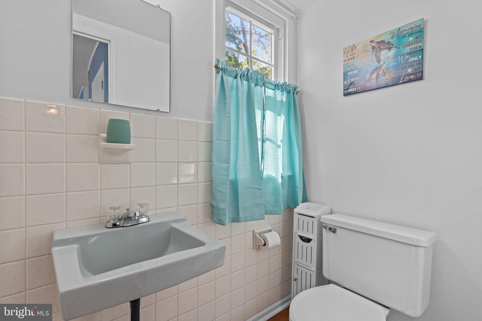 17 Highland Drive Yardley, PA 19067 - Photo 14 of 29 a bathroom with a toilet sink and mirror