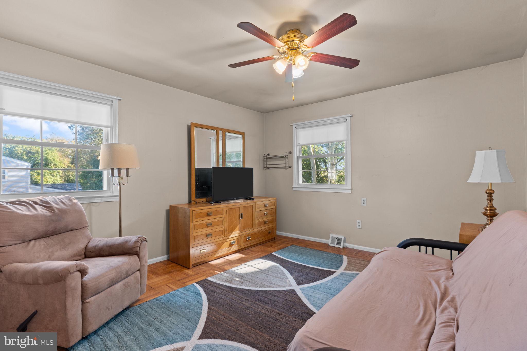 17 Highland Drive Yardley, PA 19067 - Photo 19 of 29 a living room with furniture and a flat screen tv