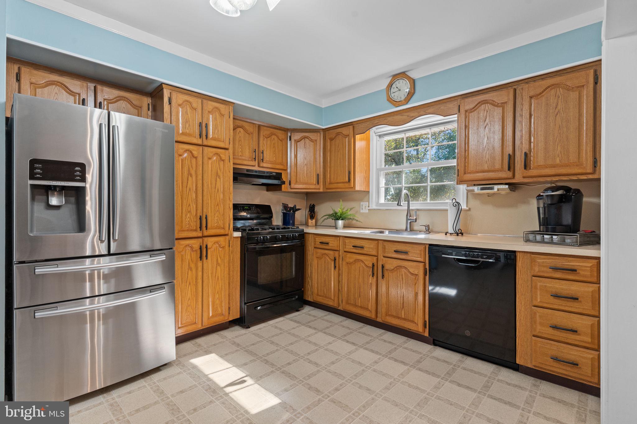 17 Highland Drive Yardley, PA 19067 - Photo 6 of 29 a kitchen with granite countertop a refrigerator a stove a sink and dishwasher