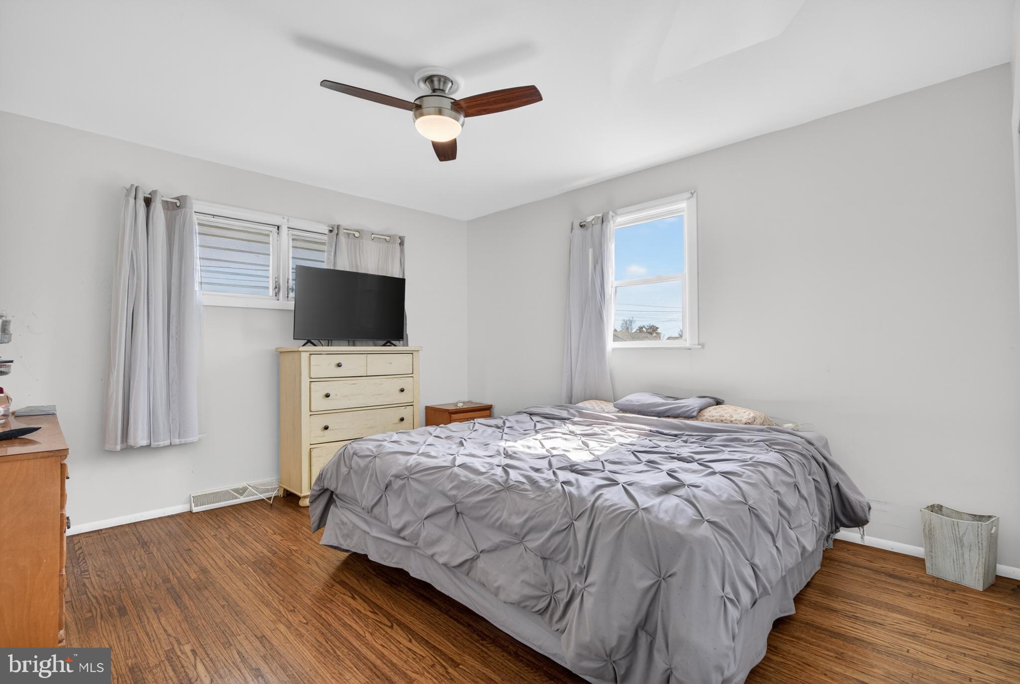 505 Monroe Street Riverside, NJ 08075 - Photo 12 of 35 a bedroom with a bed and a flat screen tv