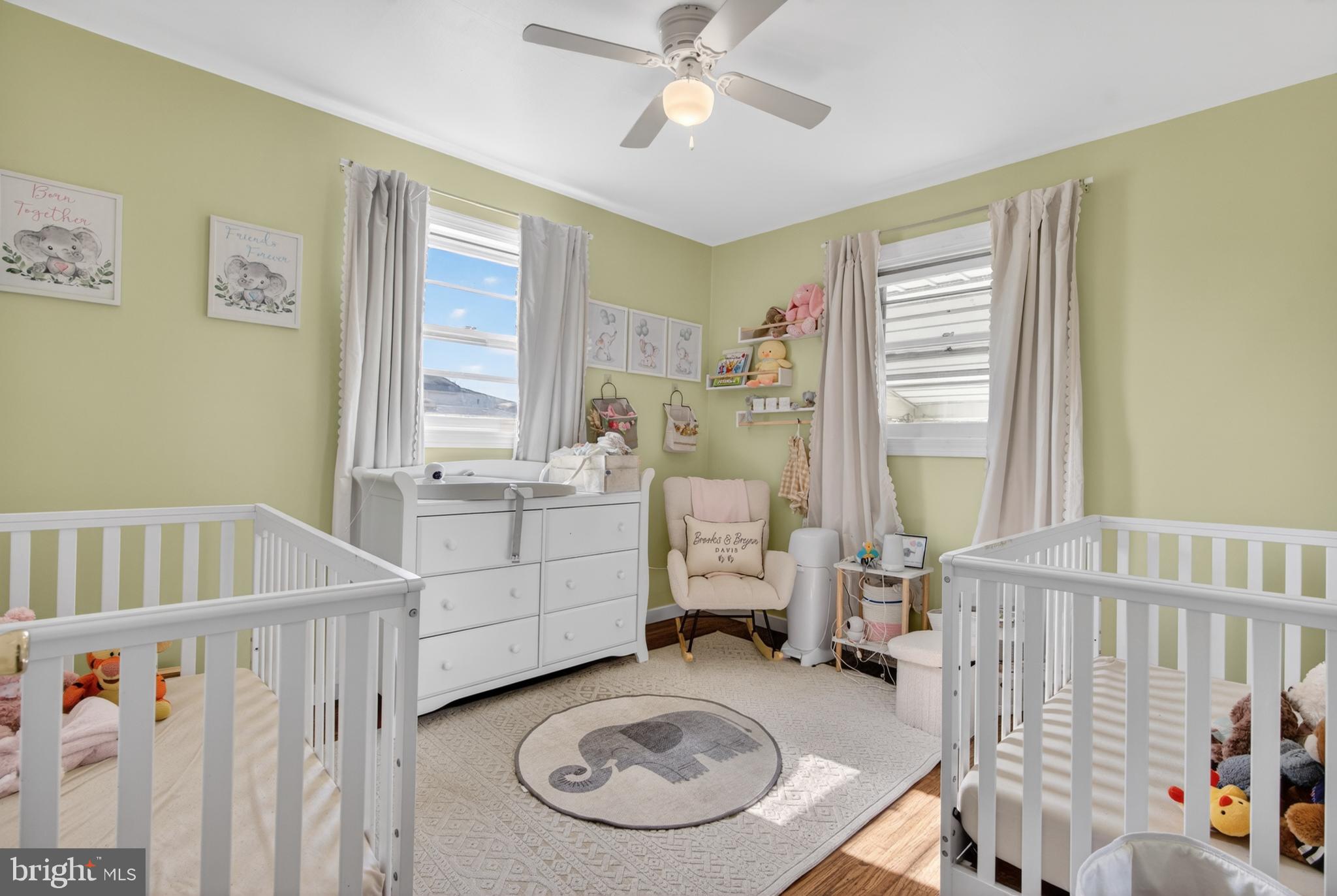 505 Monroe Street Riverside, NJ 08075 - Photo 15 of 35 a view of a bedroom with baby crib and a window