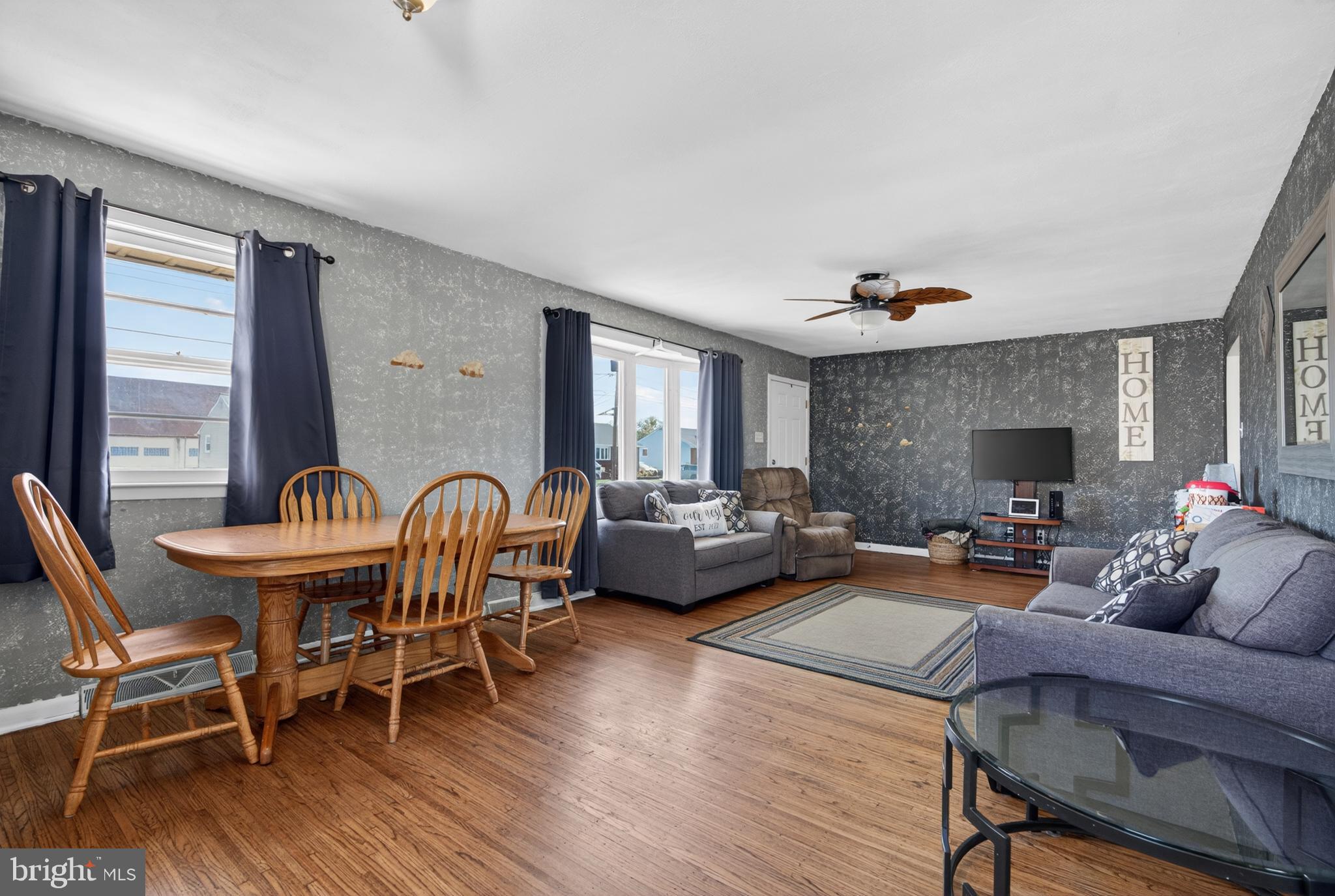 505 Monroe Street Riverside, NJ 08075 - Photo 3 of 35 a living room with furniture a wooden floor and a fireplace