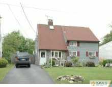 138 Ridge Road Colonia, NJ 07067 - Photo 1 of 8 a aerial view of a house with a yard