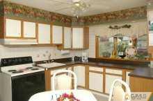 138 Ridge Road Colonia, NJ 07067 - Photo 2 of 8 a kitchen with a sink a counter top space and cabinets