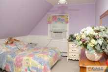 138 Ridge Road Colonia, NJ 07067 - Photo 8 of 8 a bedroom with a bed and a potted plant