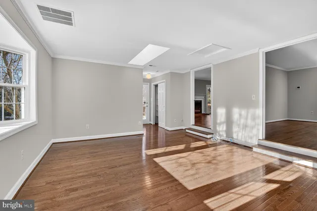 a bathroom with a granite countertop sink toilet and a mirror