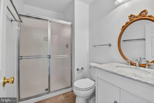 a view of a livingroom with wooden floor and a window