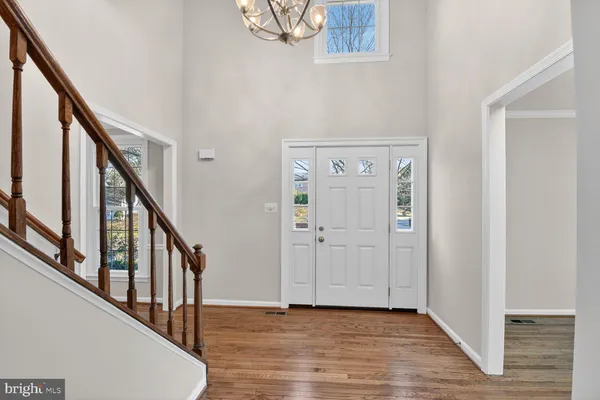a view of an entryway with wooden floor
