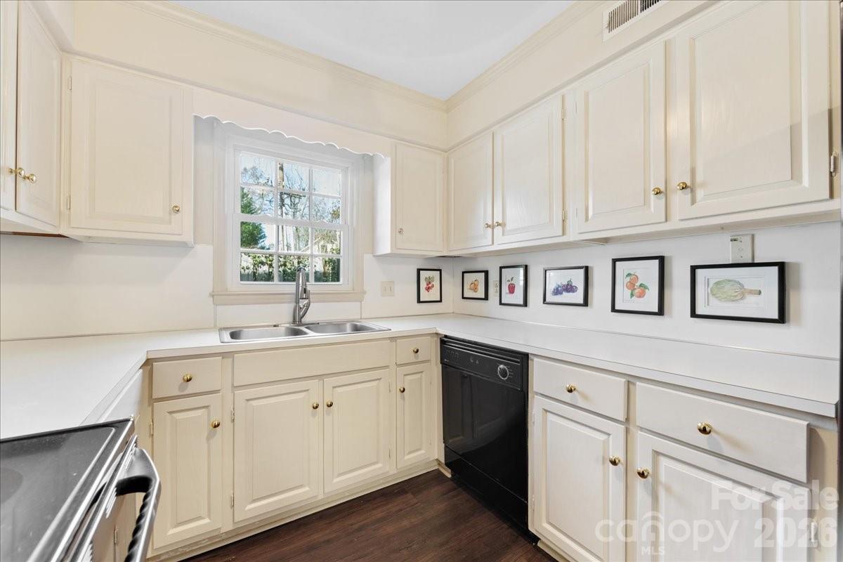 3500 Colony Road, Unit J Charlotte, NC 28211 - Photo 11 of 42 a kitchen with white cabinets and sink
