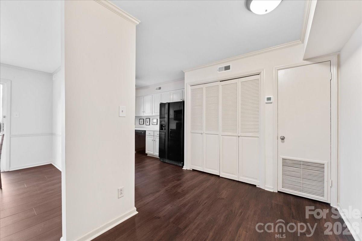 3500 Colony Road, Unit J Charlotte, NC 28211 - Photo 14 of 42 a view of a kitchen with a refrigerator and wooden floor