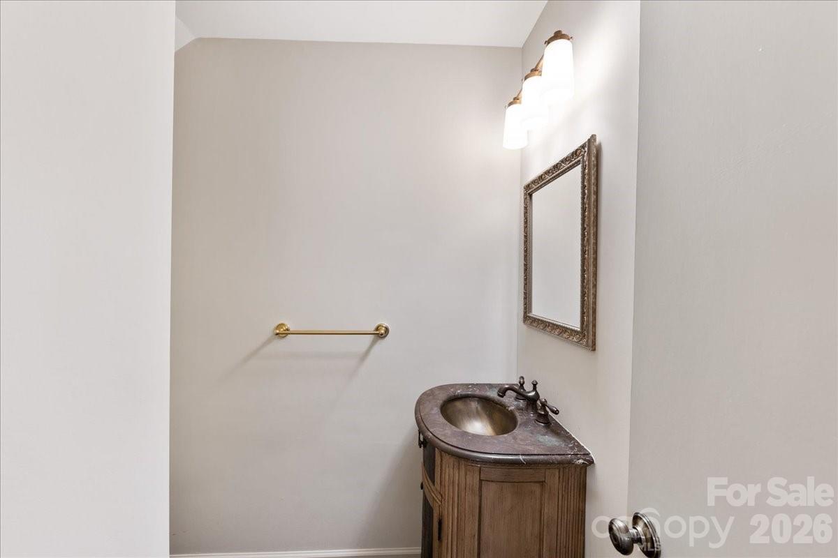 3500 Colony Road, Unit J Charlotte, NC 28211 - Photo 20 of 42 a bathroom with a sink and mirror