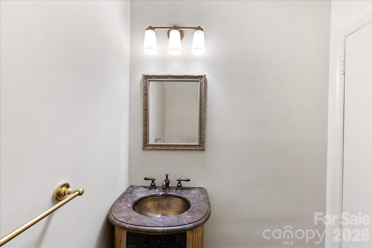 3500 Colony Road, Unit J Charlotte, NC 28211 - Photo 21 of 42 a bathroom with a sink and a mirror