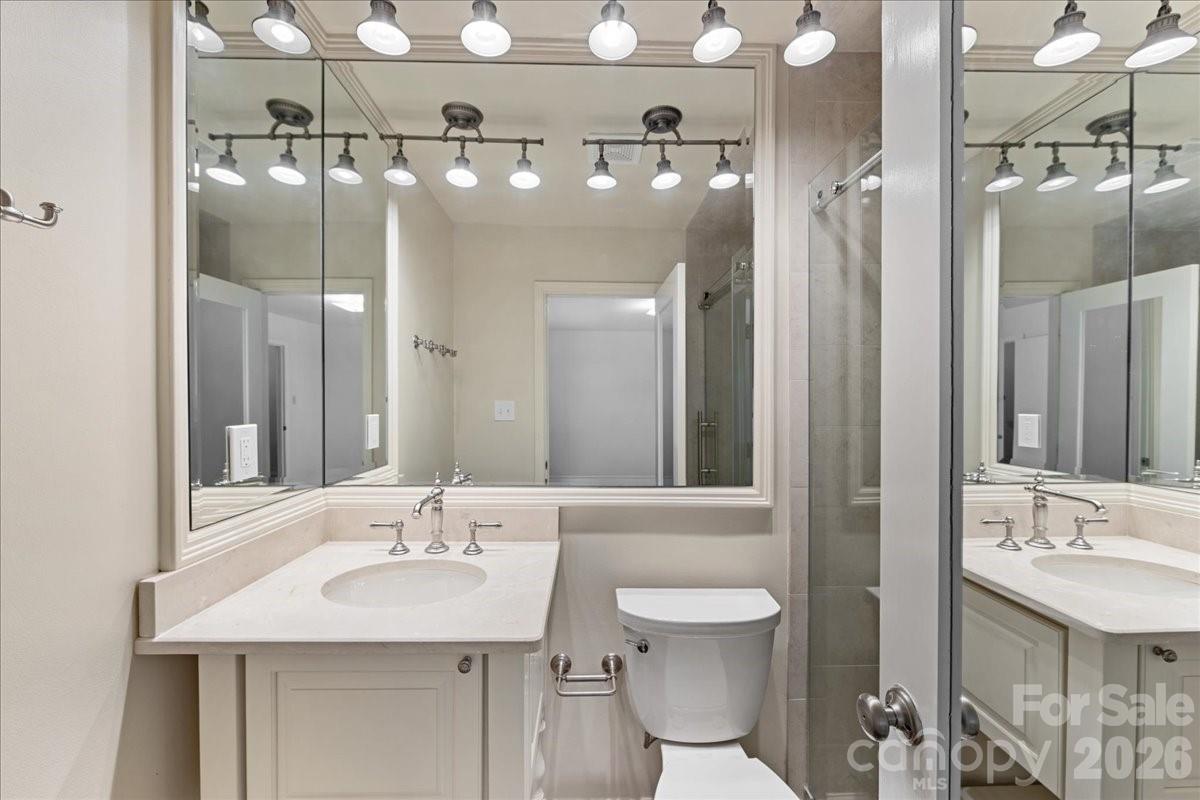 3500 Colony Road, Unit J Charlotte, NC 28211 - Photo 24 of 42 a bathroom with a sink and a mirror