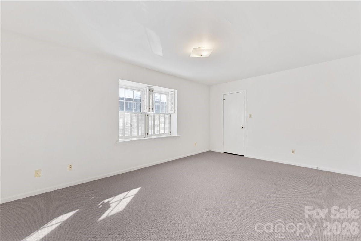 3500 Colony Road, Unit J Charlotte, NC 28211 - Photo 27 of 42 an empty room with windows