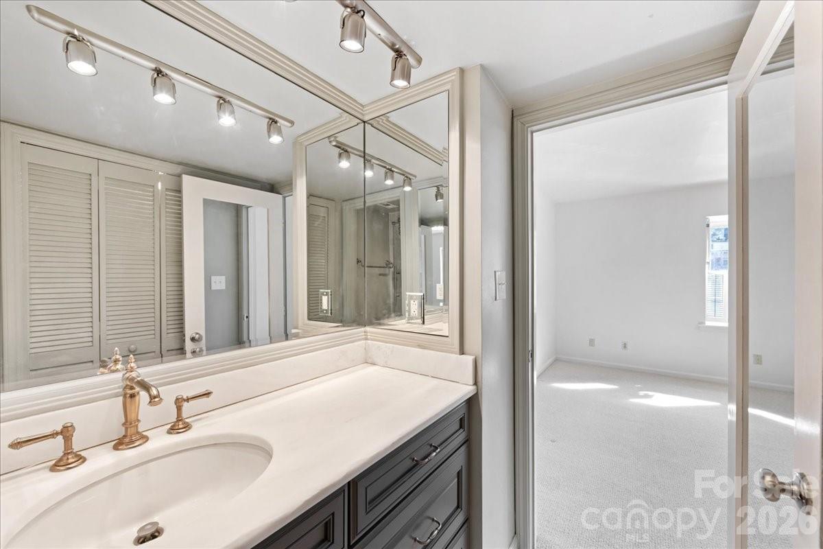3500 Colony Road, Unit J Charlotte, NC 28211 - Photo 34 of 42 a bathroom with a sink and a mirror
